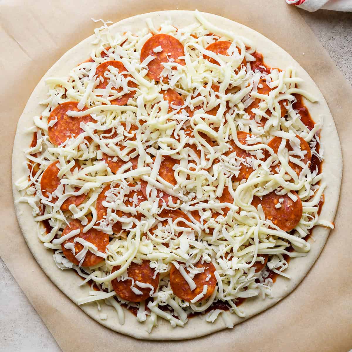 How to Make Pepperoni Pizza - cheese on top of pepeproni